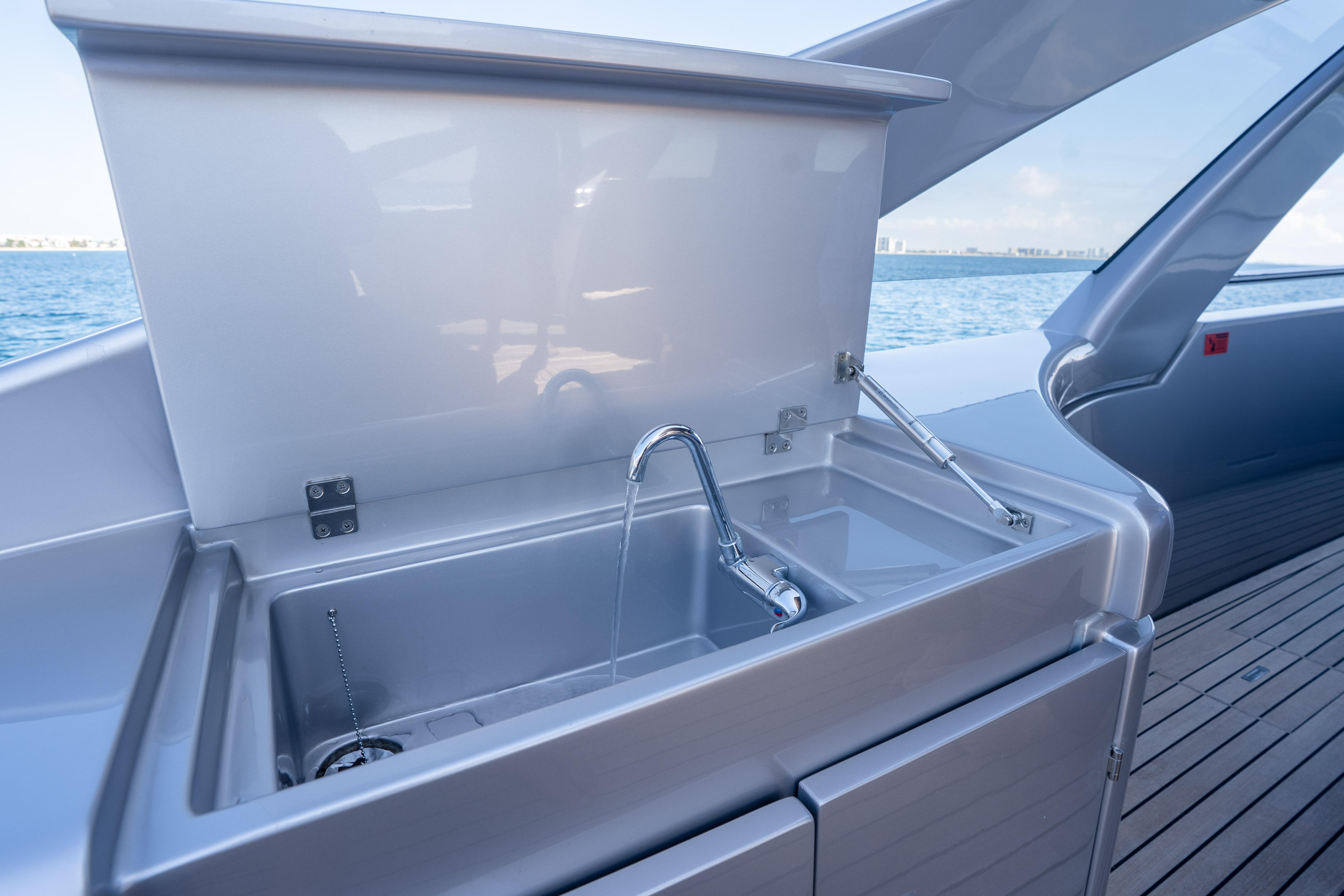 Outdoor sink on 2024 Pershing 7X yacht with ocean view.