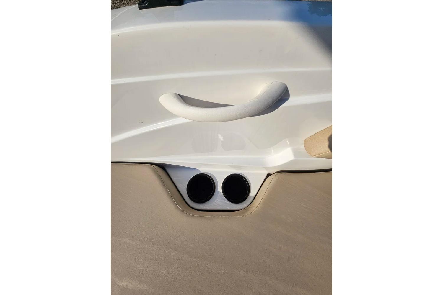 2025 Hurricane SunDeck Sport 205 OB boat interior detail with handle and cup holders.