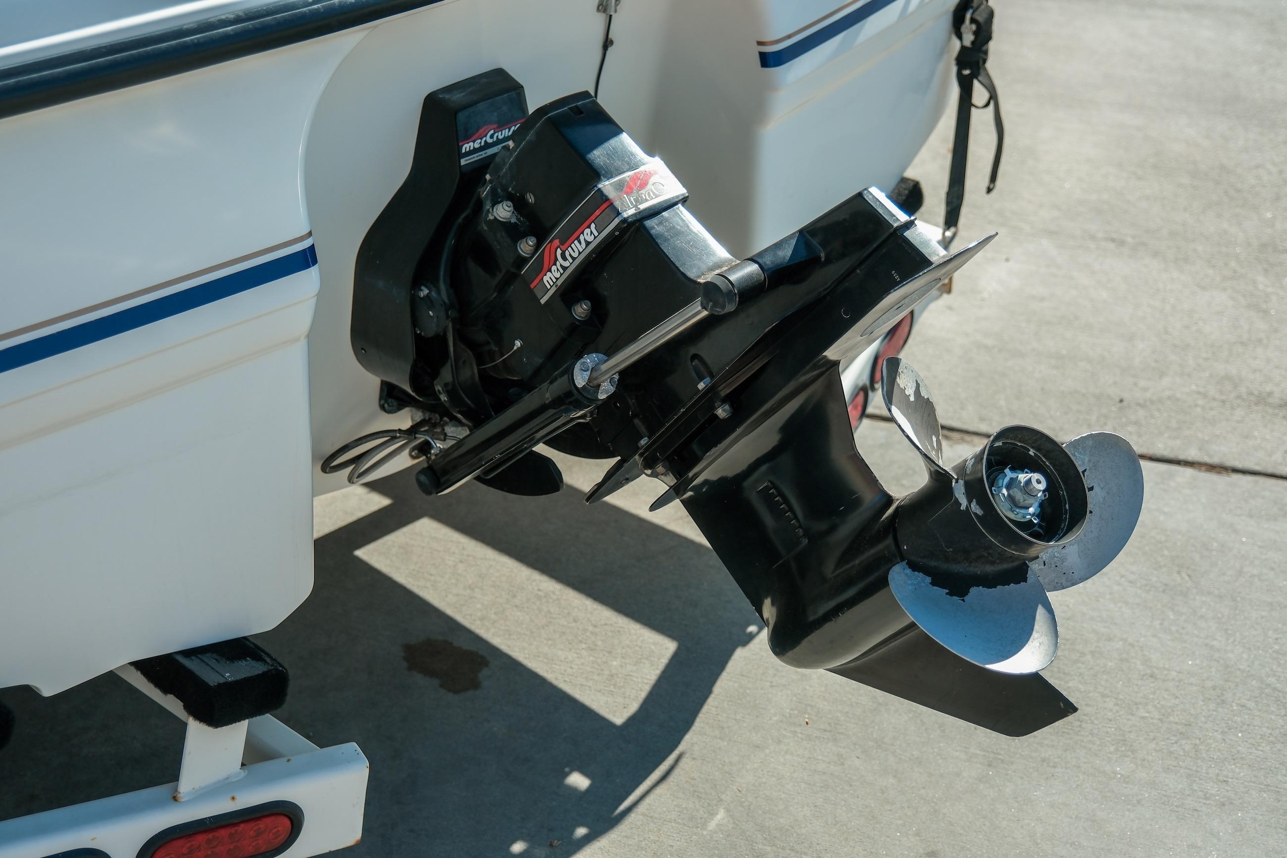 1998 Chaparral 232 Sunesta boat with MerCruiser outdrive on concrete surface.