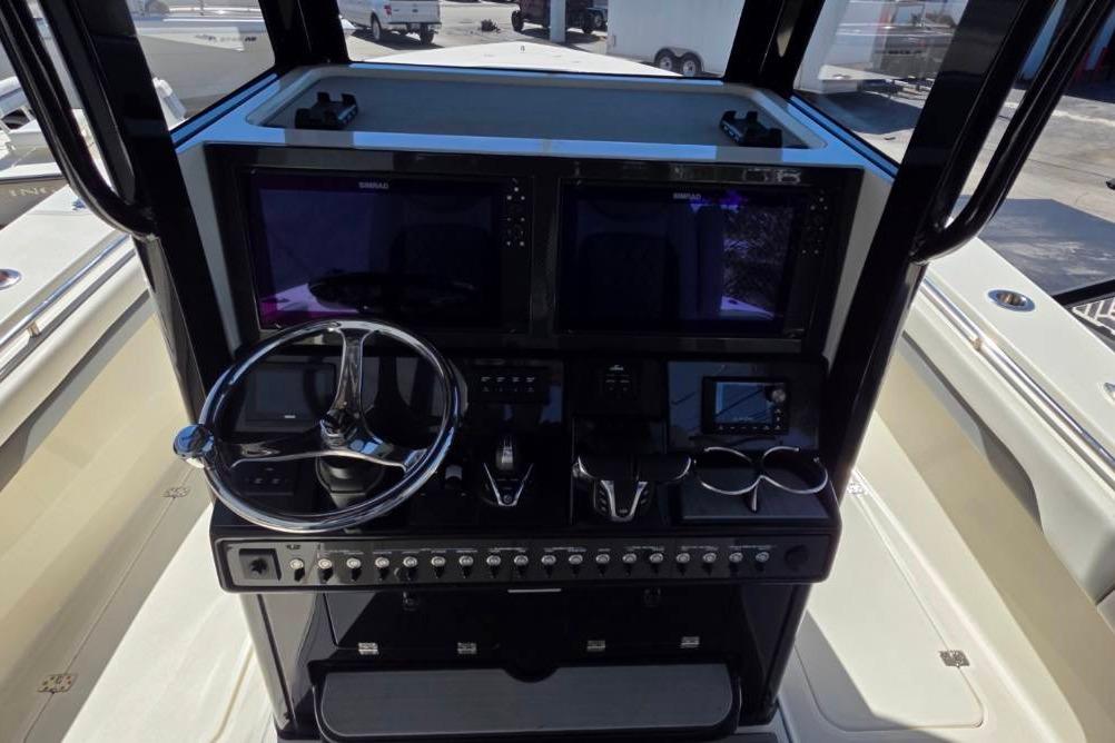 2024 Blackwood 290 boat dashboard with steering wheel and electronic controls.