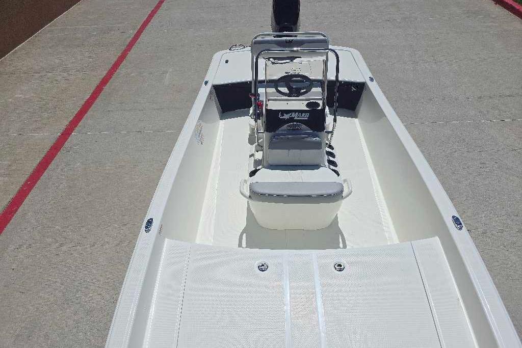 2026 Mako Pro Skiff 17 CC boat, center console, white deck, outdoor setting.
