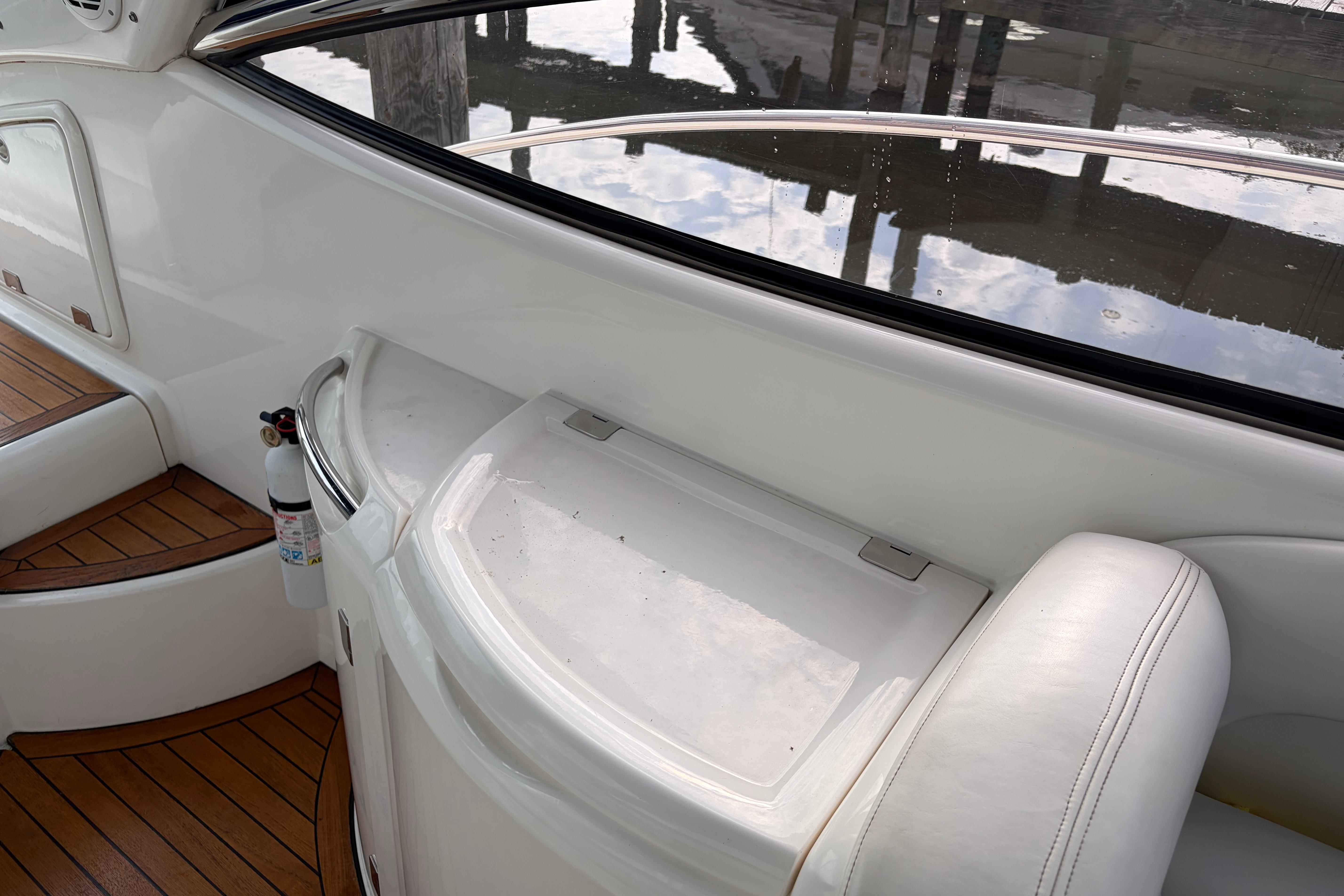 Interior view of a 2000 Sunseeker Superhawk 34 yacht with wooden flooring.