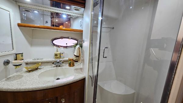 Luxurious bathroom in 2000 Carver 450 Voyager Pilothouse yacht with modern amenities.