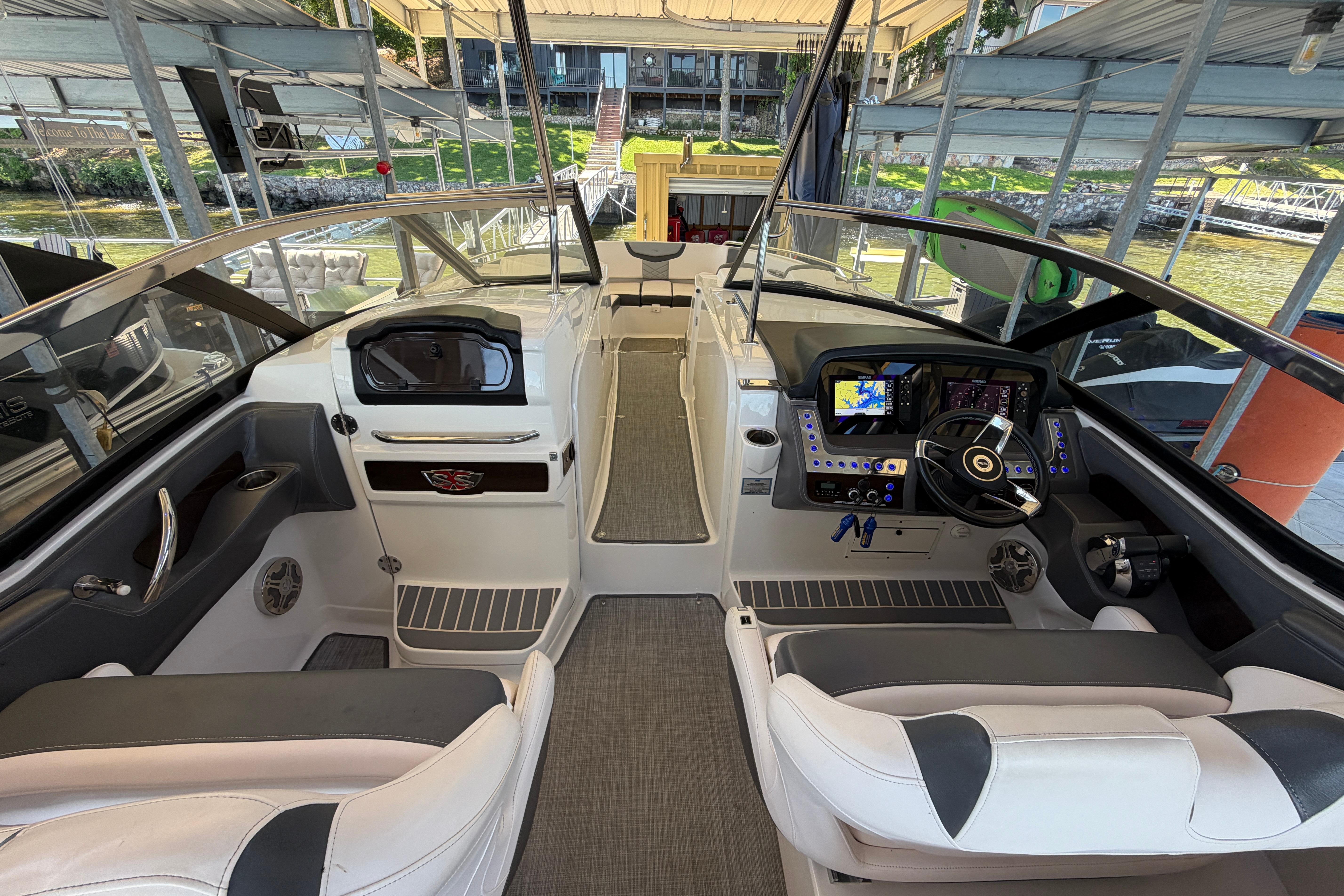 2018 Chaparral 347 SSX boat interior with modern dashboard and seating.