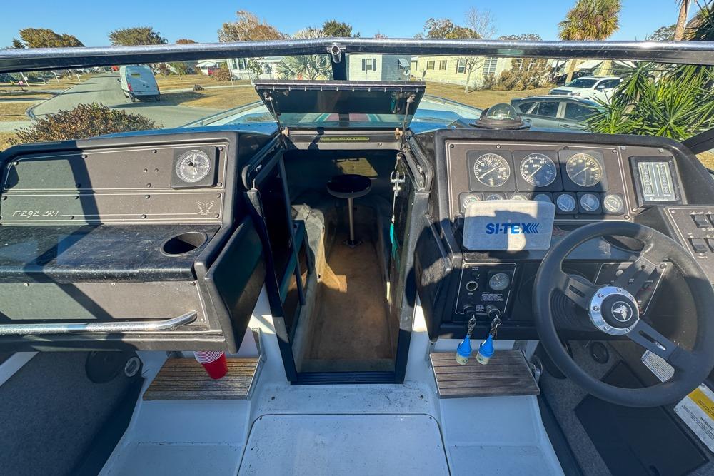 1989 Formula 292 SR-1 boat cockpit with steering wheel and dashboard instruments.