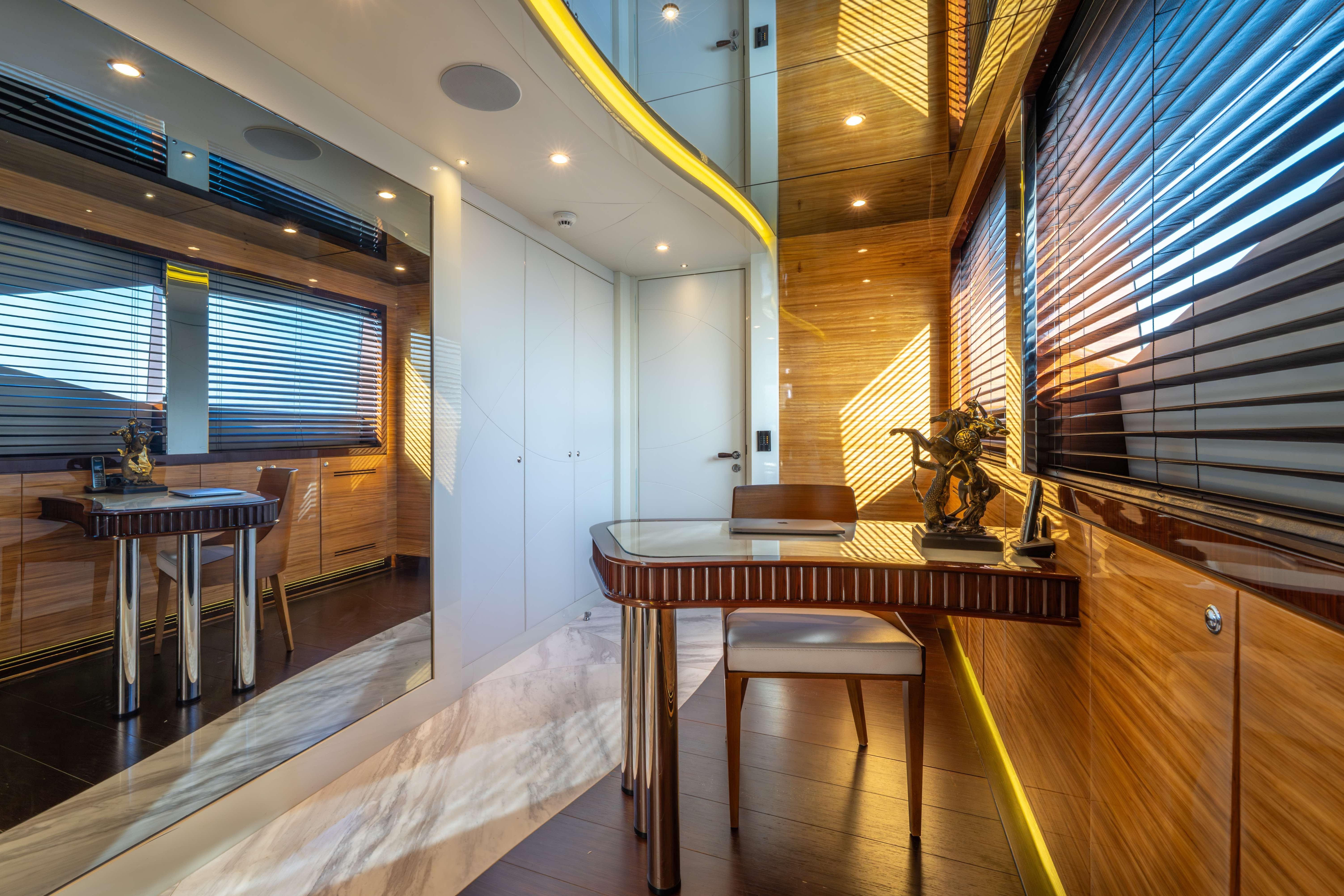 Luxurious interior of 2014 Bilgin 147 yacht with elegant wood paneling and modern decor.
