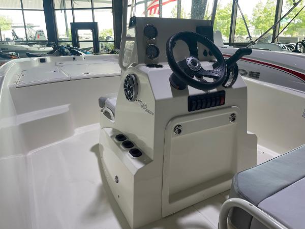 2024 Mako Pro Skiff 19 CC center console boat interior with steering wheel.