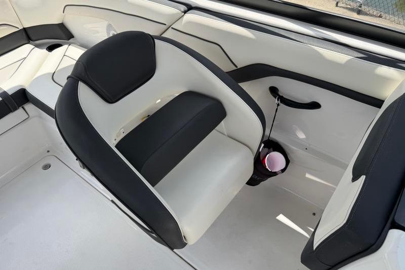 2017 Yamaha Boats SX210 interior with black and white seating and cup holder.