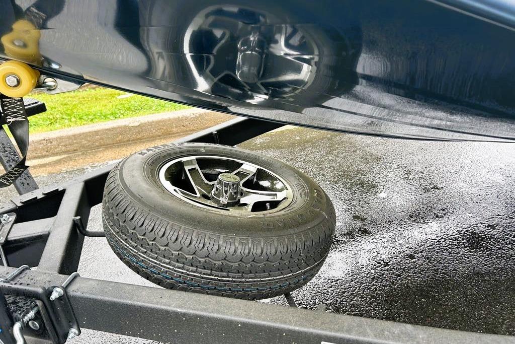 2026 Ranger RT188P trailer with spare tire on wet pavement.