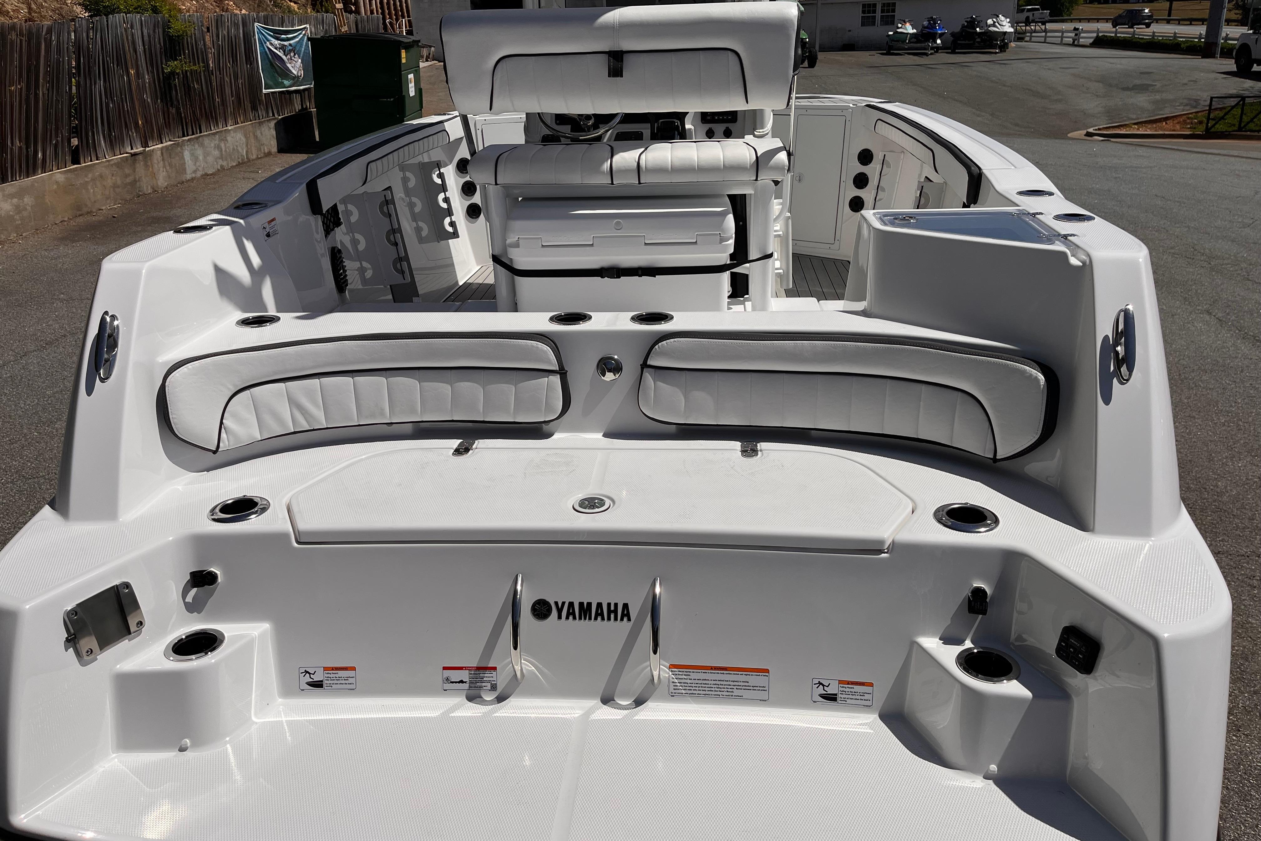 2026 Yamaha Boats 222 FSH Sport E interior, featuring sleek white seating and modern design.