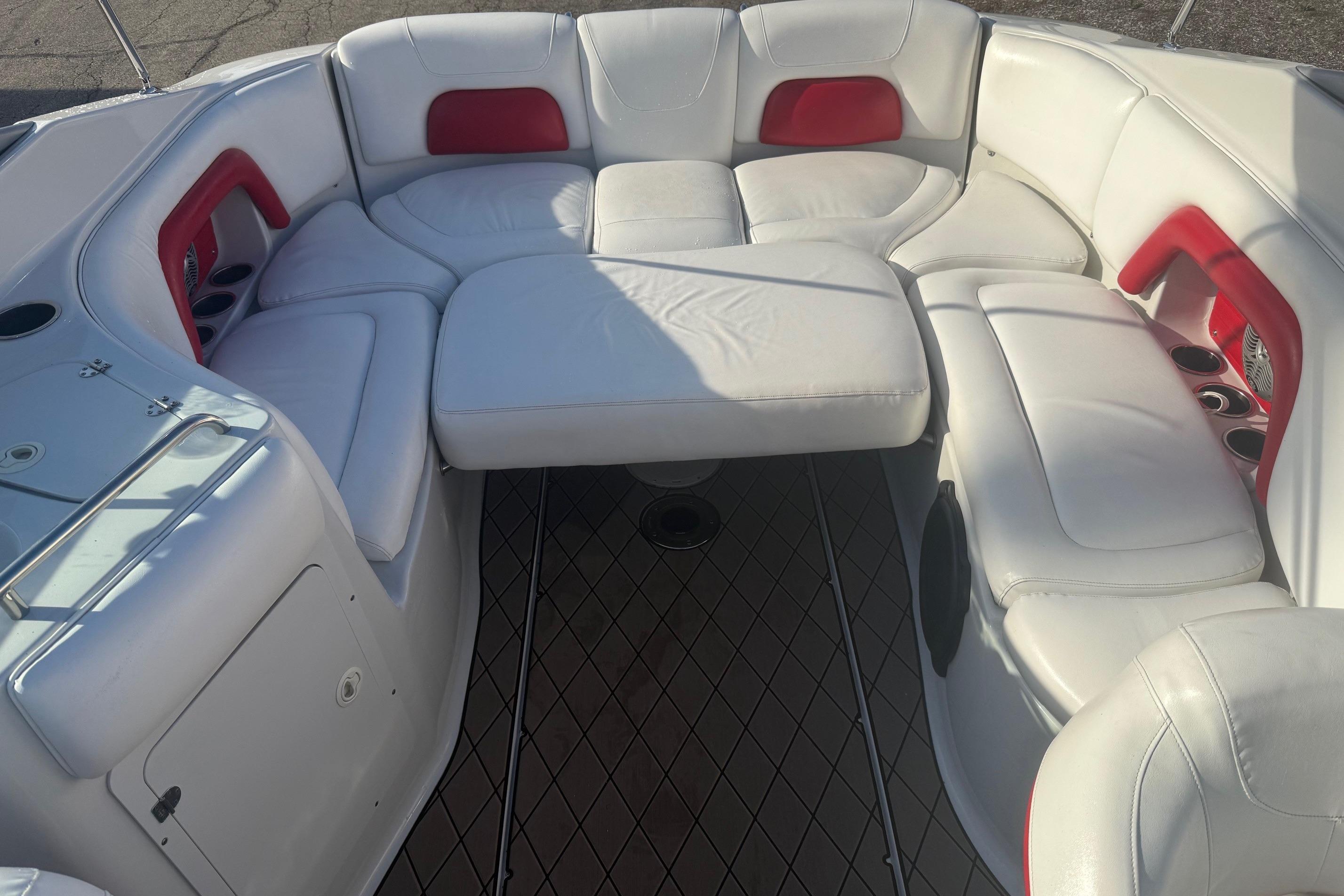 2005 Crownline 270 BR boat interior with white and red seating arrangement.