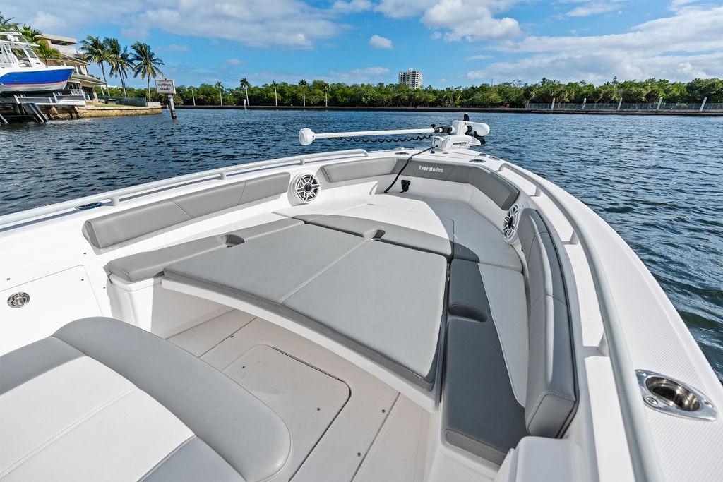 2023 Everglades 243 Center Console boat with spacious seating on a sunny day.