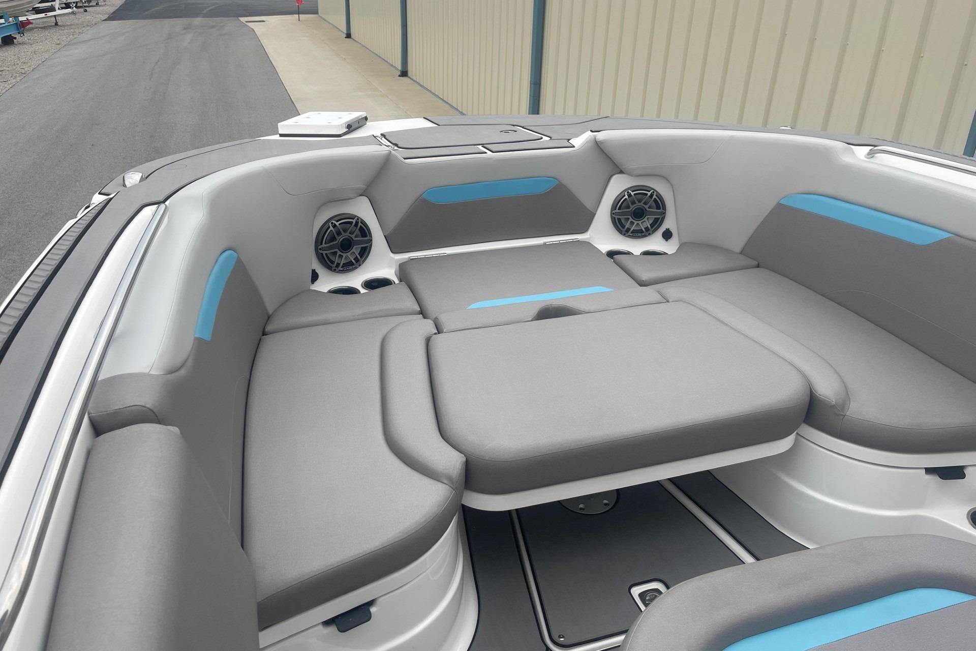 2025 Hurricane Center Console 24 OB boat interior with gray seating and blue accents.