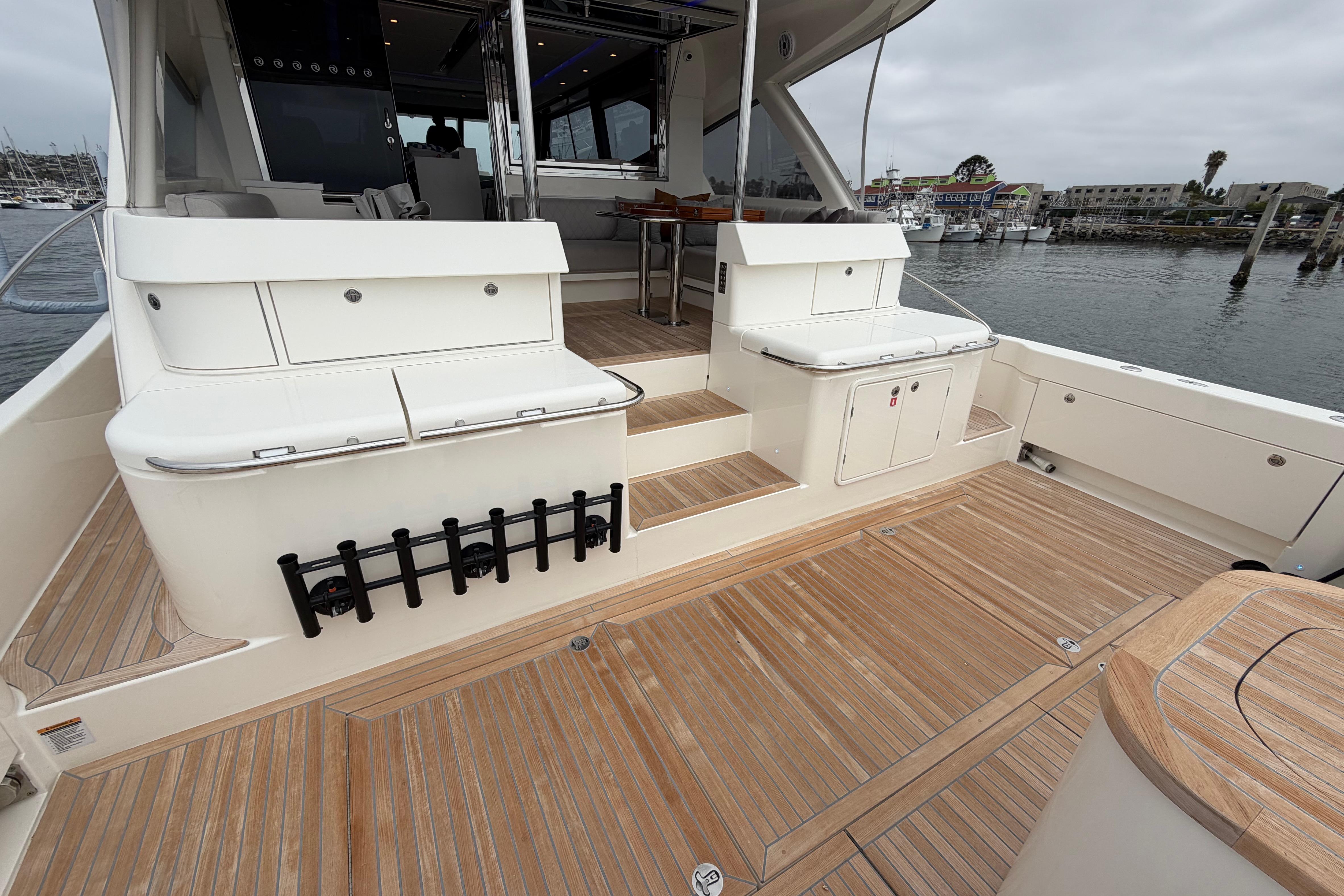 2023 Riviera 645 SUV yacht deck with sleek design and spacious seating area.