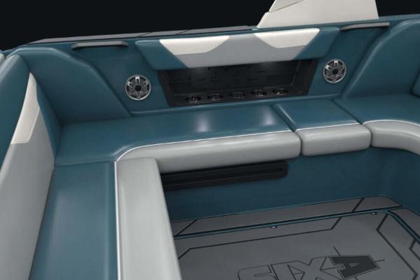 Manufacturer Provided Image: 2022 Axis A22 boat interior with teal and white seating and built-in speakers.