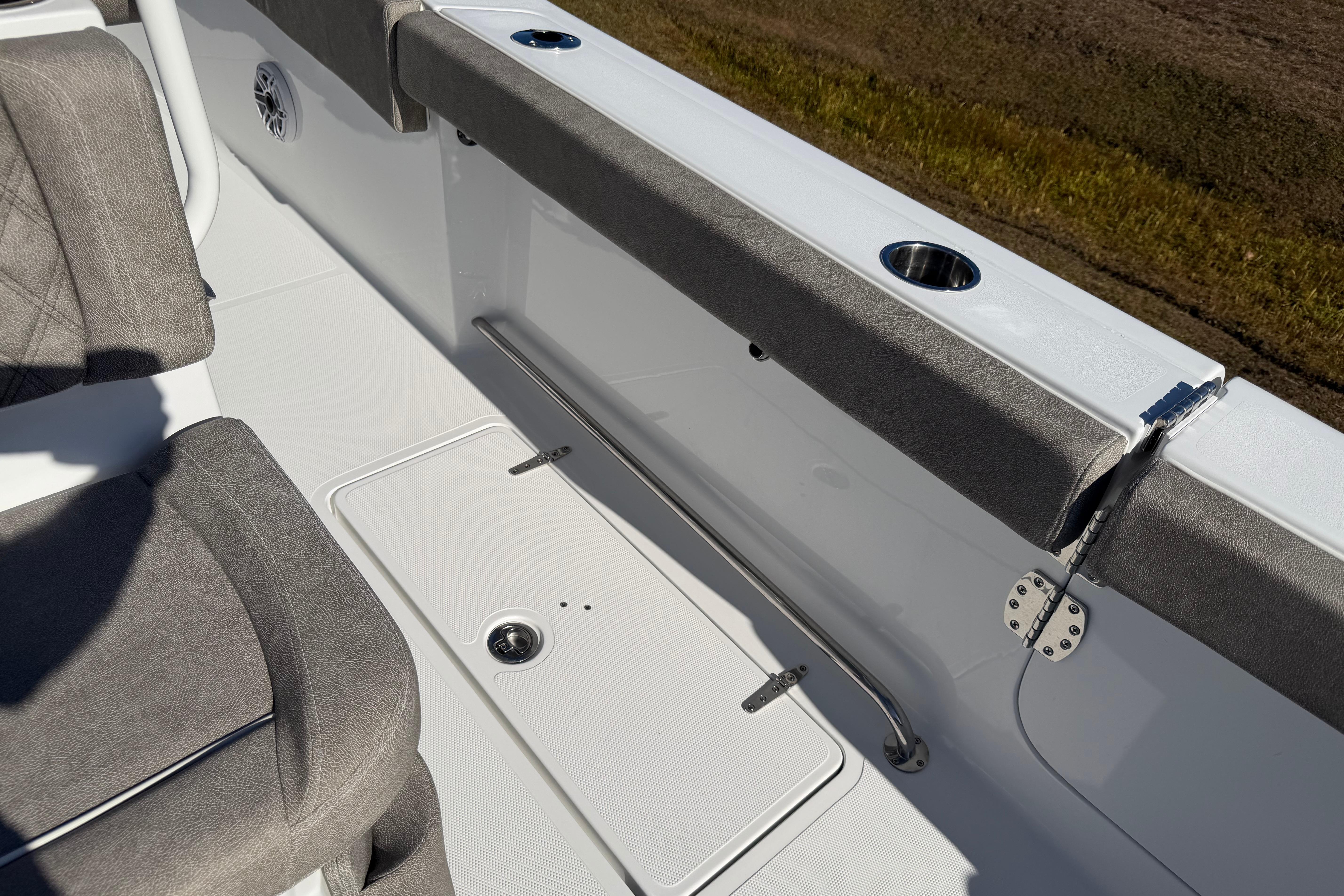 2026 Sea Hunt Ultra 275 Coffin Box interior with cushioned seating and storage compartment.