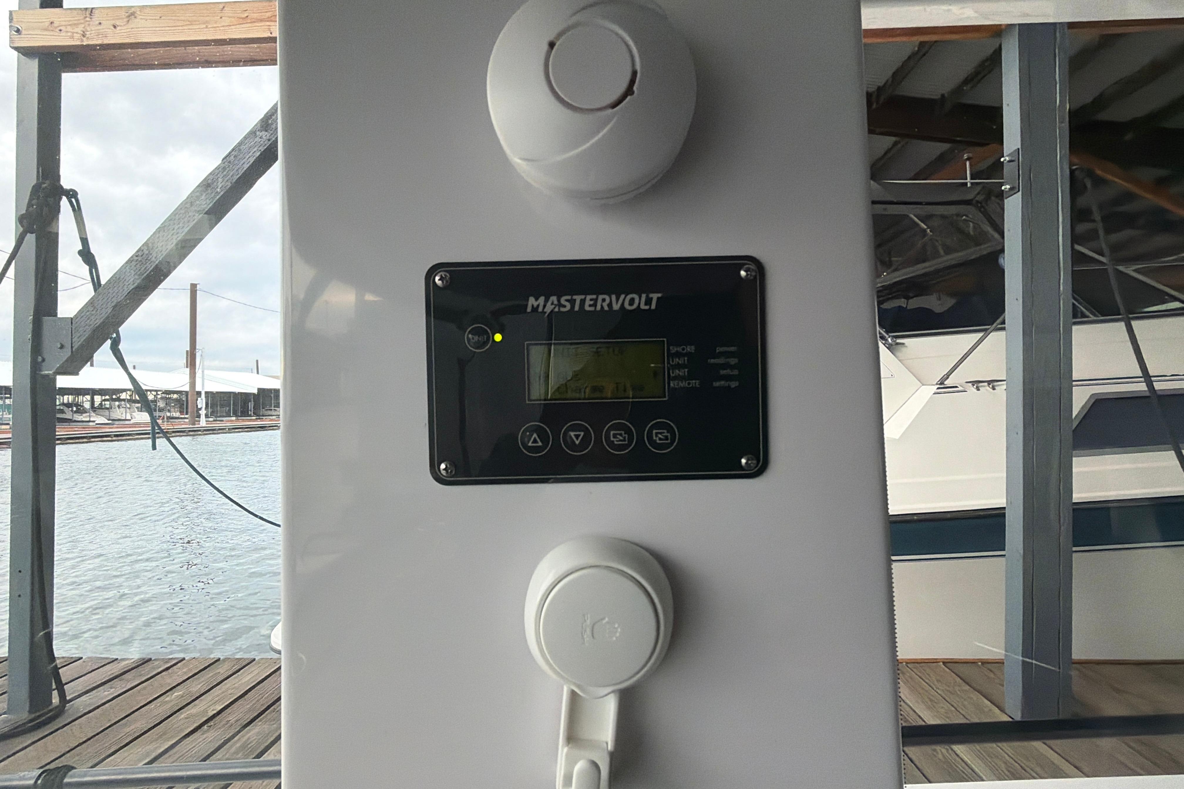 Control panel on 2022 Axopar Brabus 37 XC Cross Cabin boat docked by the water.