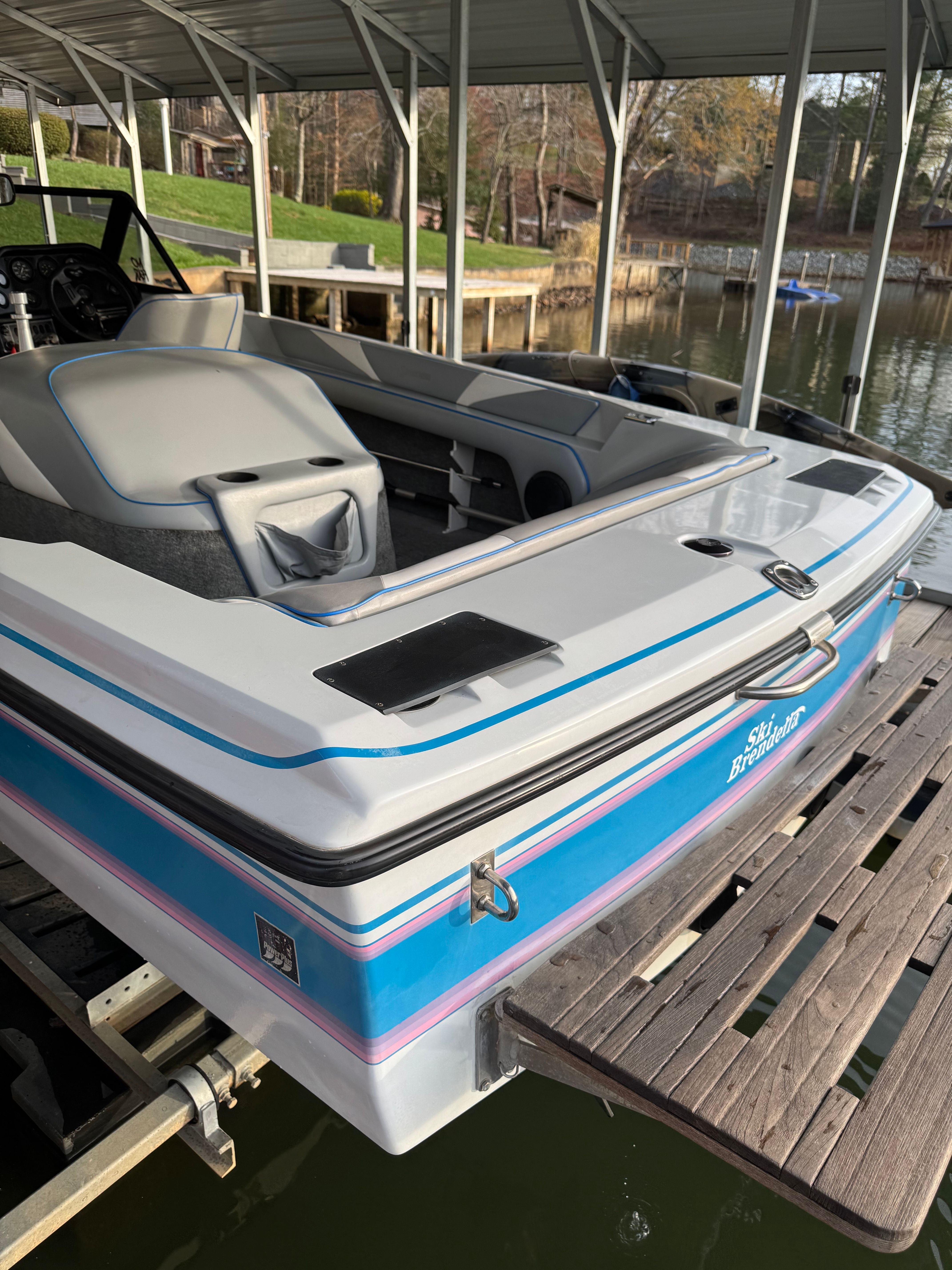 1992 Ski Brendella Spectrum boat at dock.