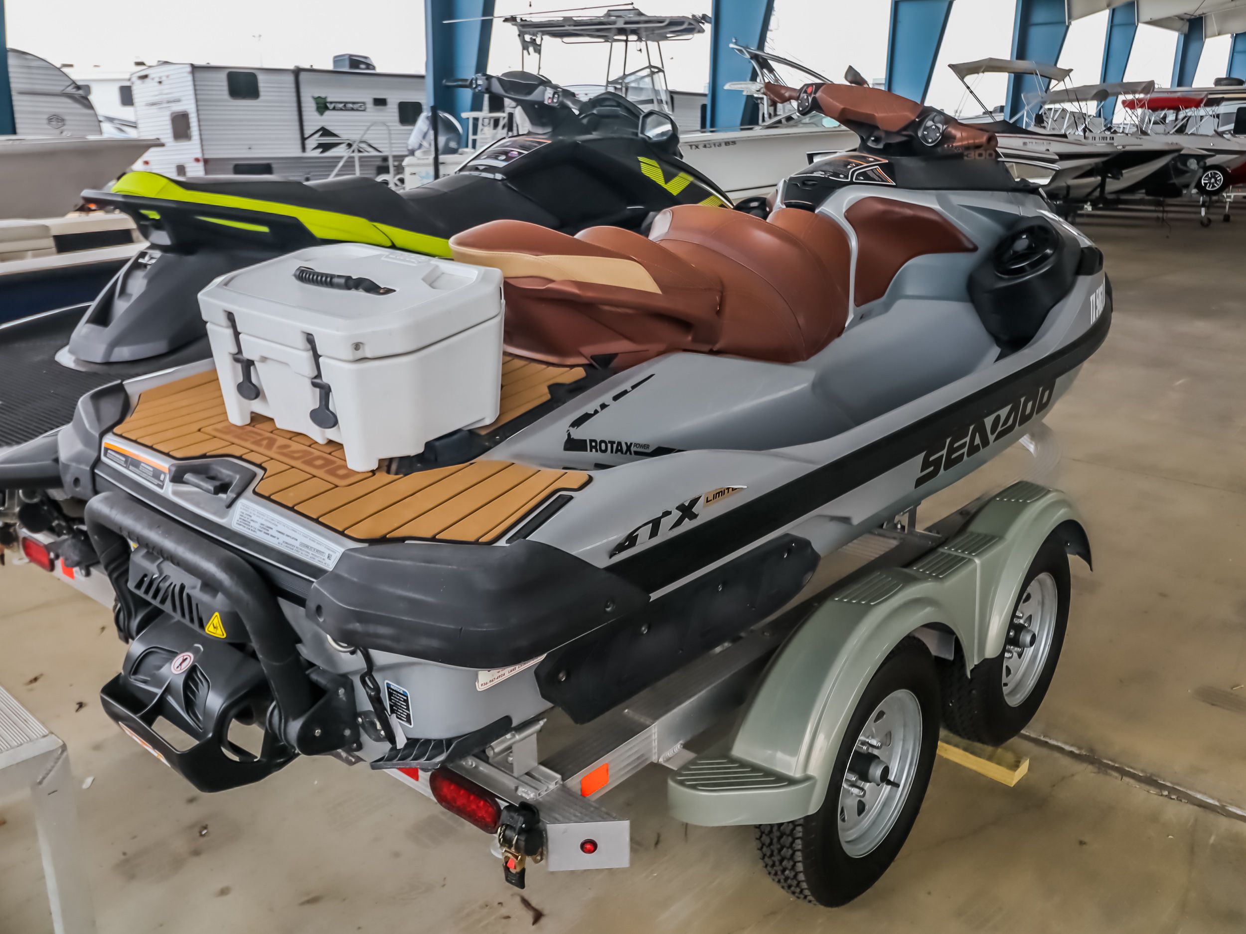 2018 Sea-Doo GTX300 jet ski on trailer in warehouse.