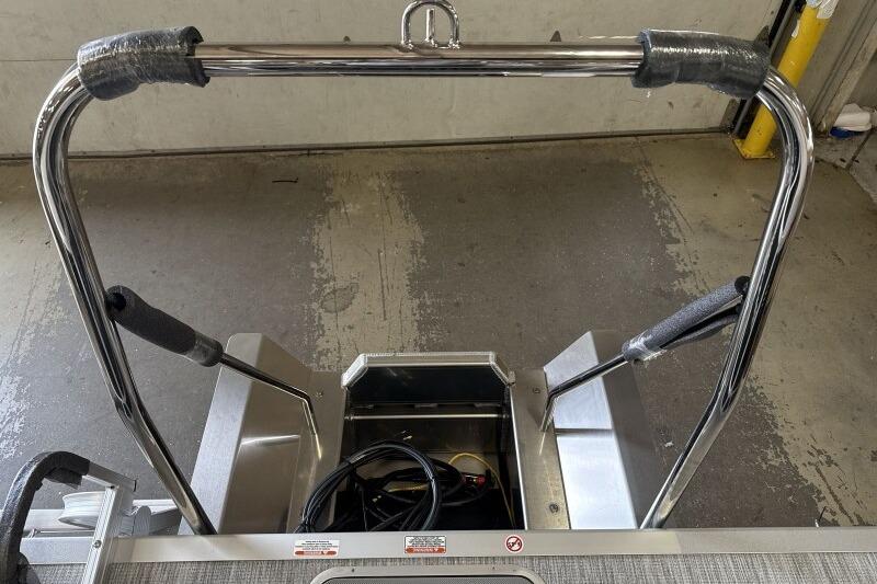 2026 Bennington 22 SSRSF boat ladder and railing in a garage setting.