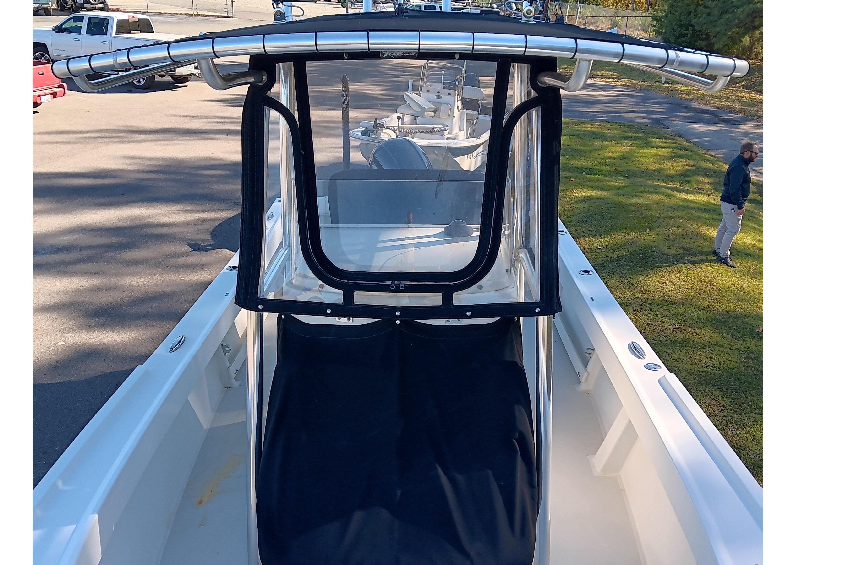 2016 Parker 2300 Special Edition boat with T-top and console cover.