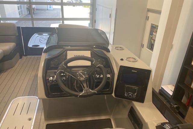 2026 Bentley Pontoons Elite 223 Swingback dashboard with steering wheel and controls.