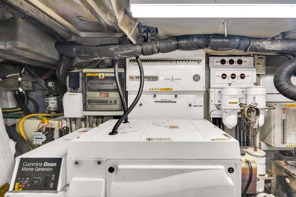 Engine room of 2012 Fairline Targa 58 yacht with Cummins Onan marine generator.