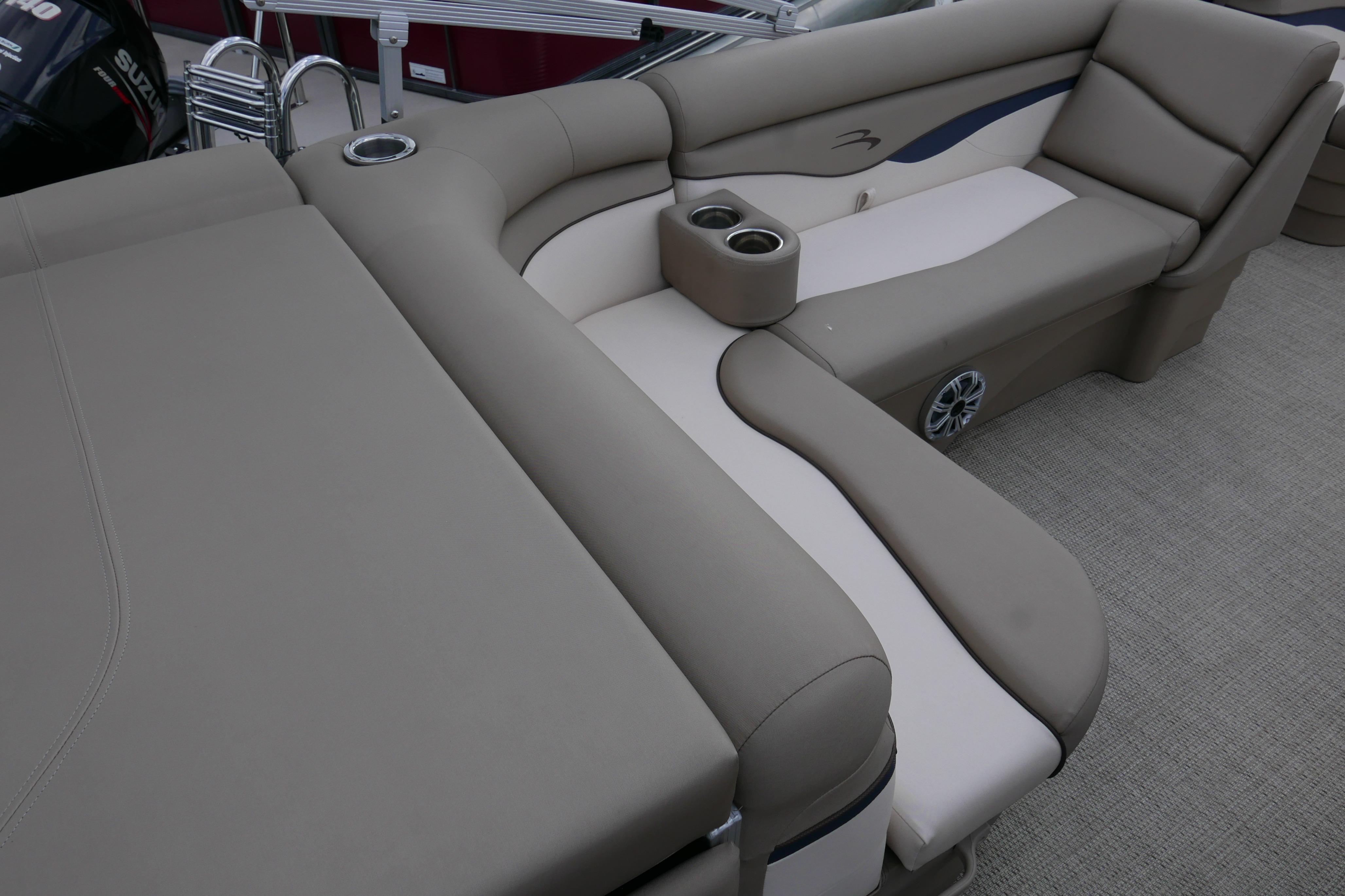 2019 Bennington SX 20 SLXP boat interior with beige seating and cup holders.