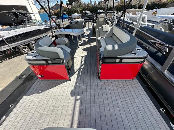 2025 Tahoe Pontoon 2585 LTZ Entertainer with red accents and spacious seating.