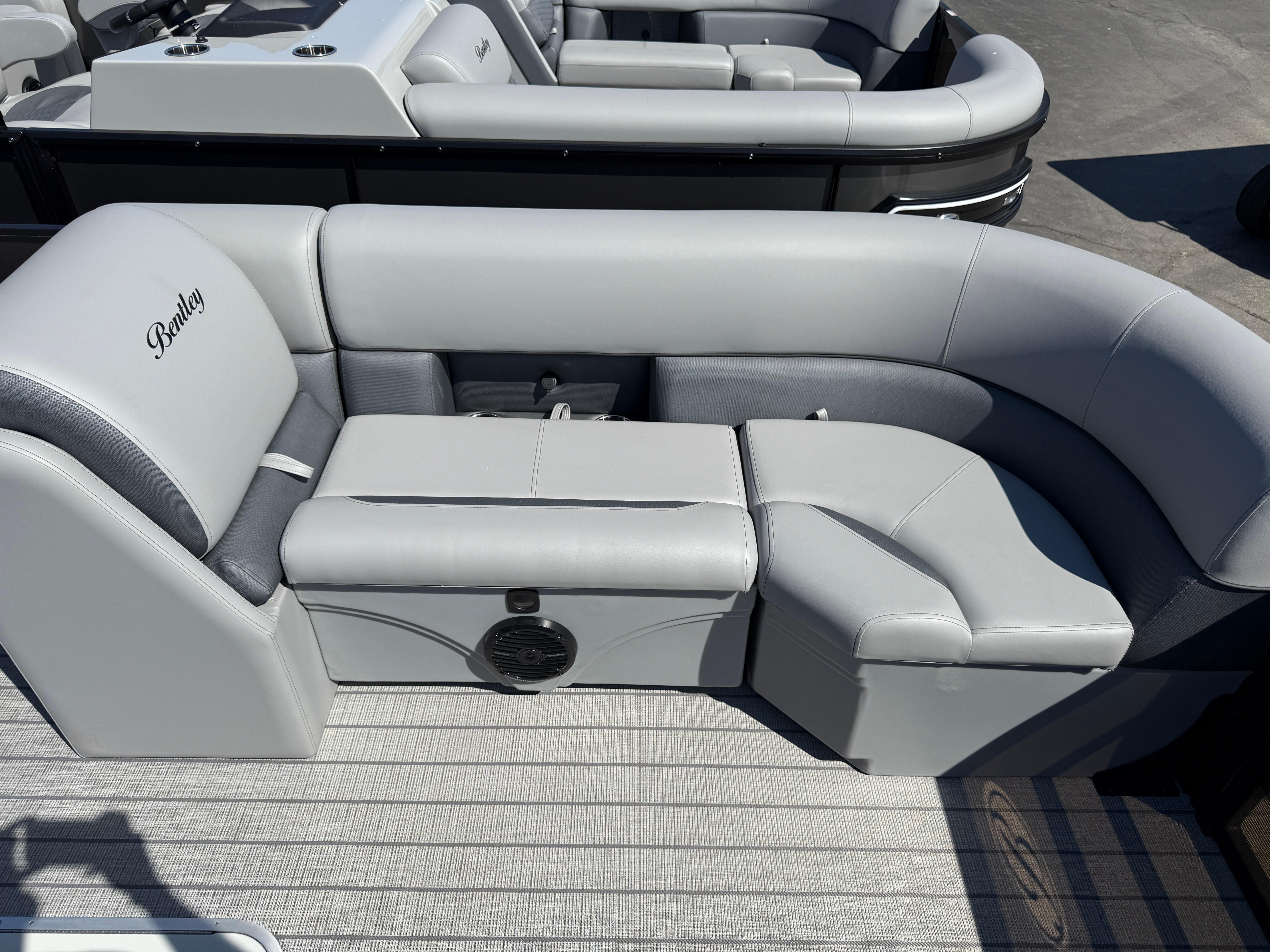 2026 Bentley Pontoons Legacy 223 Navigator interior with luxurious gray seating.