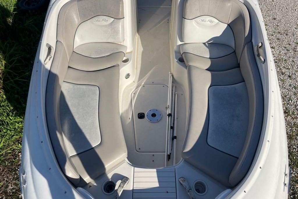 2004 Sea Ray 240 Sundeck boat interior with spacious seating and cup holders.