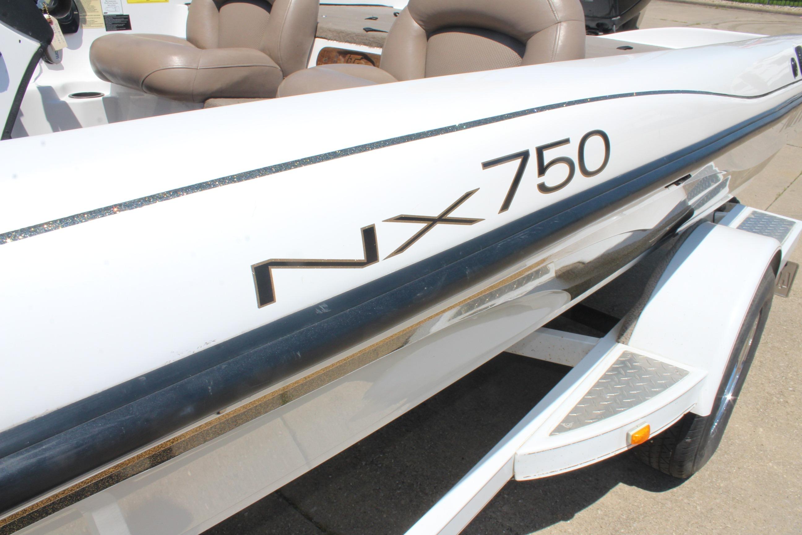 2003 Nitro NX 750 SC boat with sleek white exterior and comfortable seating.