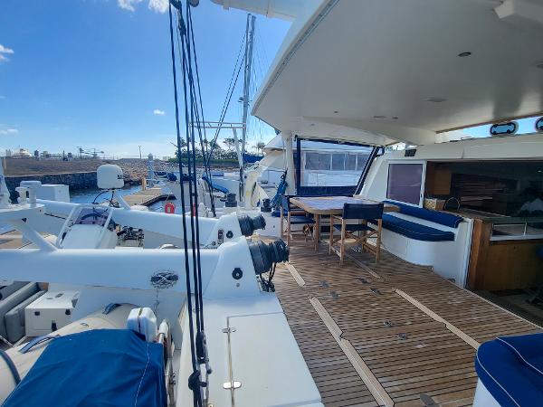 2009 Catana 65 yacht deck with seating and dining area.