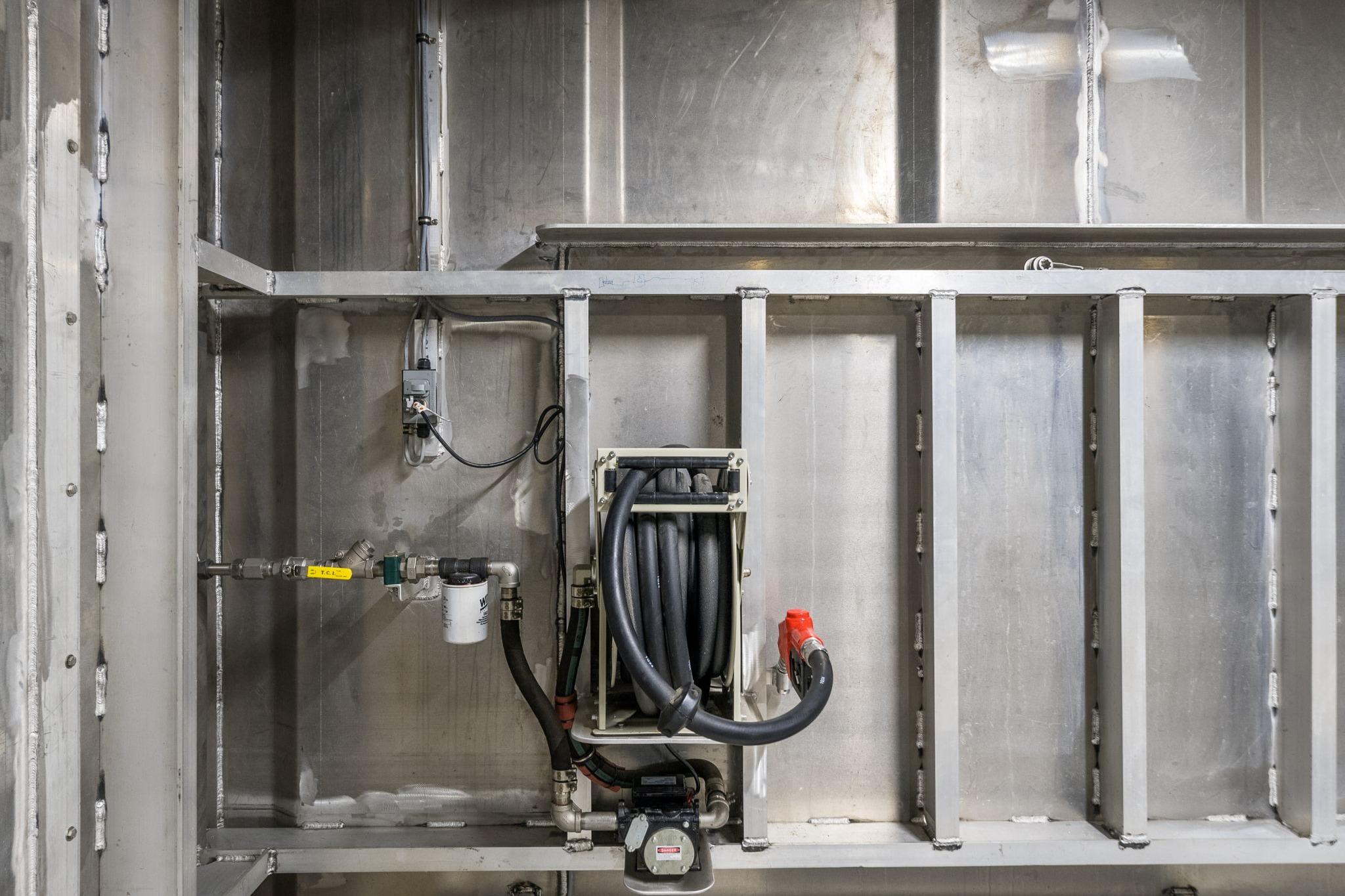 Interior view of Breaux Brothers 120 GLV 2025, showcasing industrial piping and wiring.