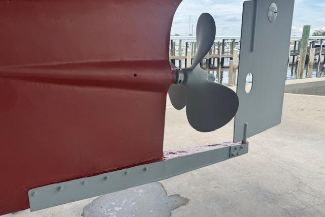 Propeller and rudder of 1986 Krogen 42 Classic boat at dockside.