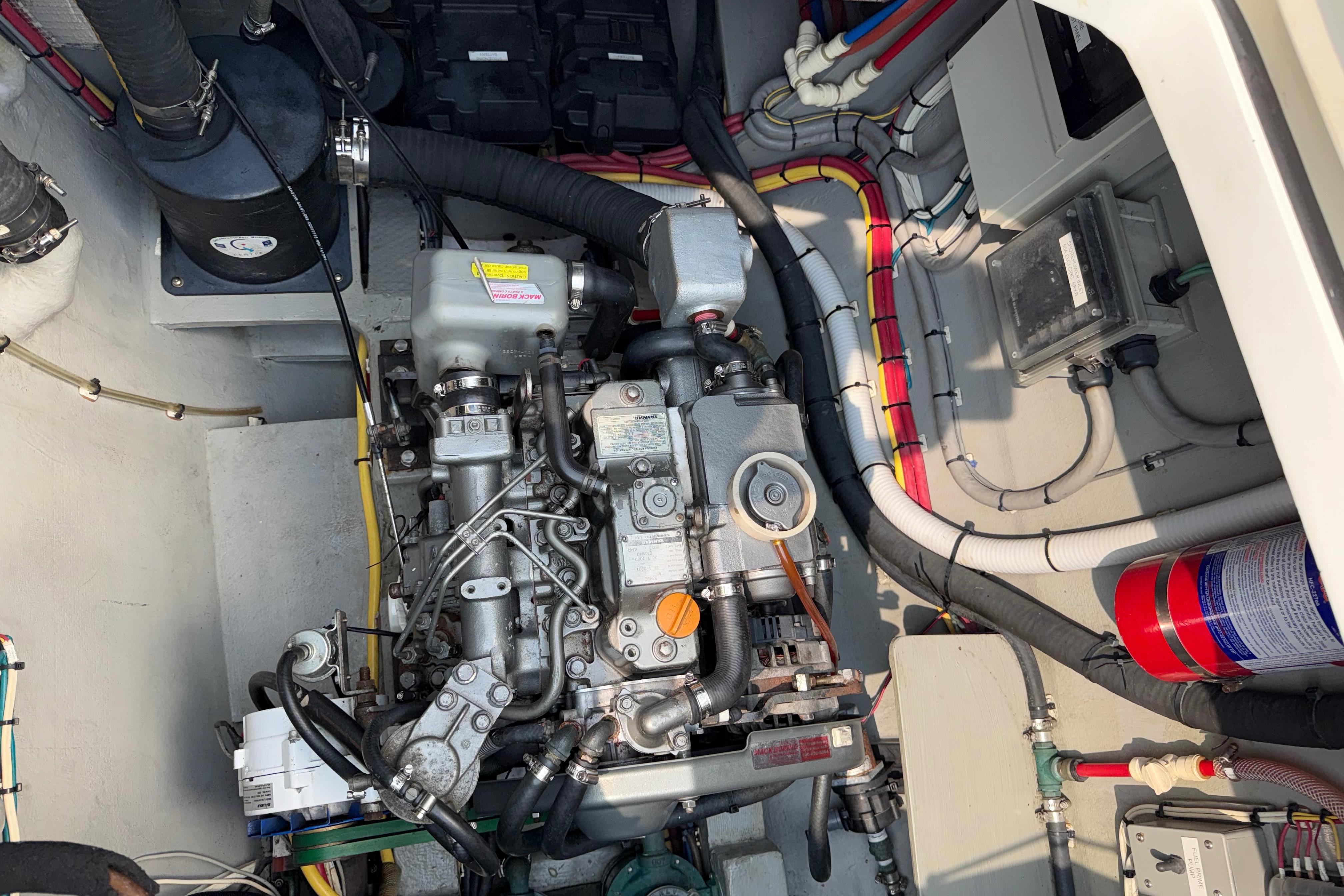 Engine compartment of a 2015 Gunboat 57' yacht, showcasing detailed mechanical components.