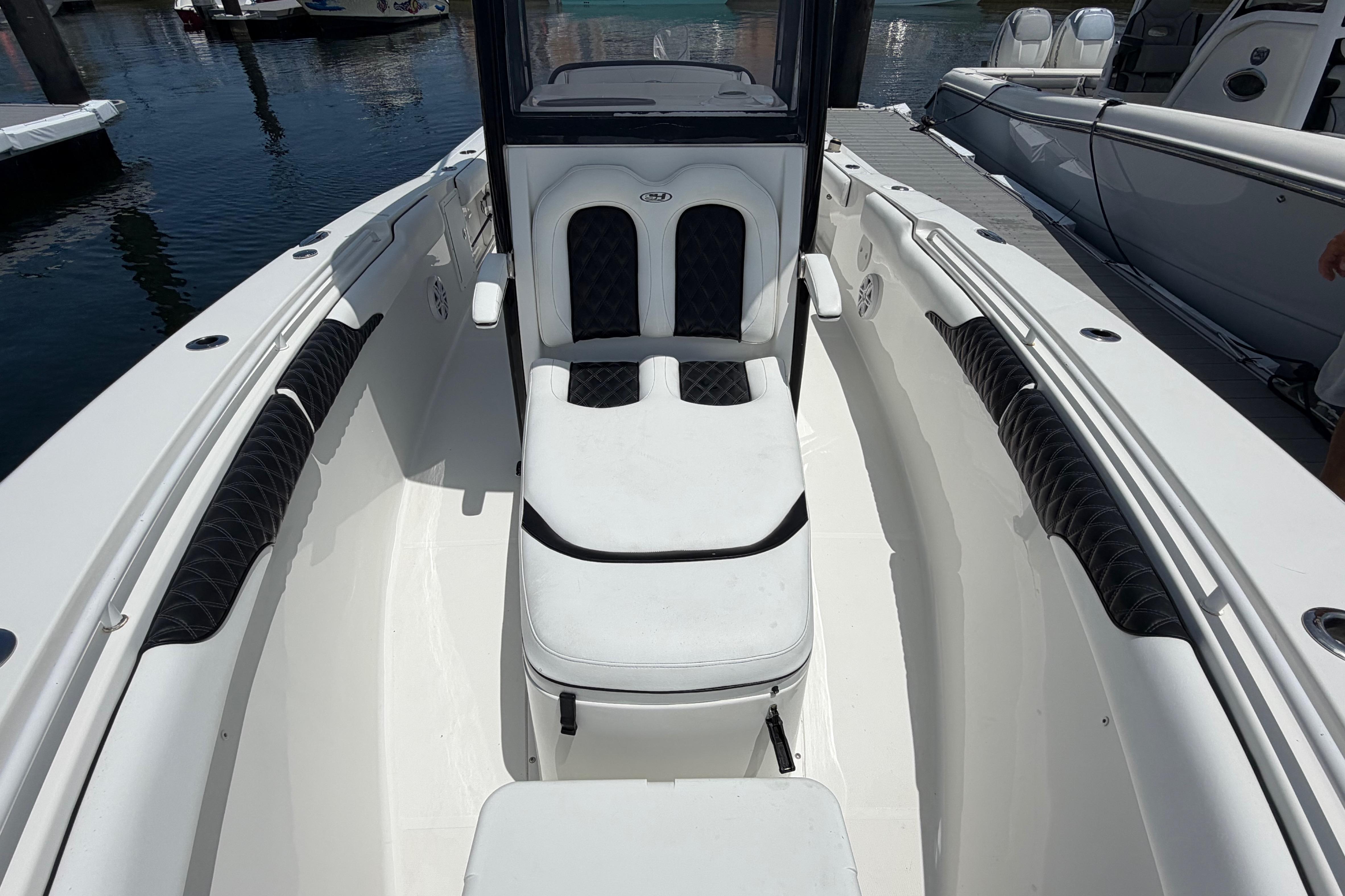 2019 Sea Hunt Gamefish 27 Coffin Box boat interior with cushioned seating and sleek design.