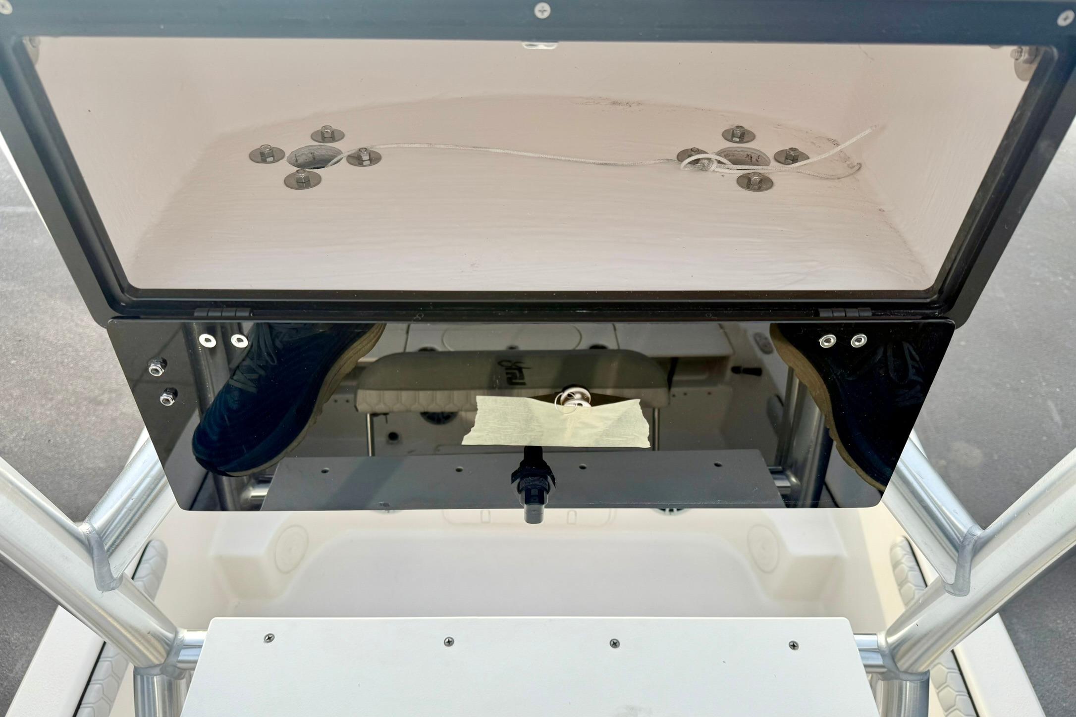 2025 Carolina Skiff 21 LS boat console with storage compartment and mounting hardware.