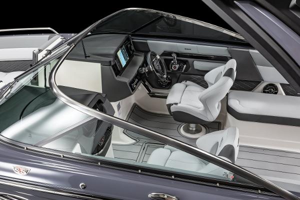 2025 Chaparral 2870 boat interior with modern dashboard and seating.