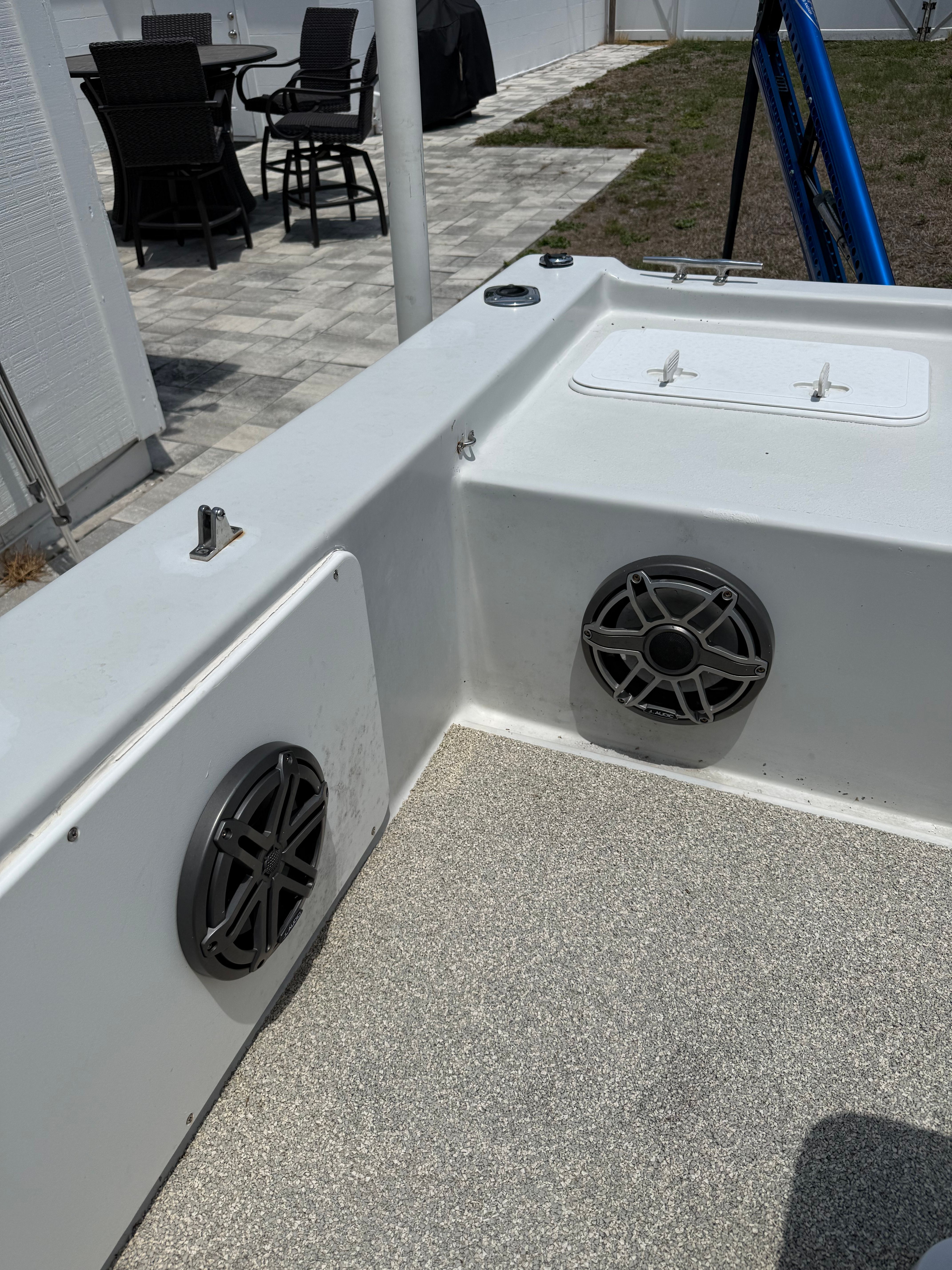 Interior of a 2012 Bay Craft 21 boat with speakers.