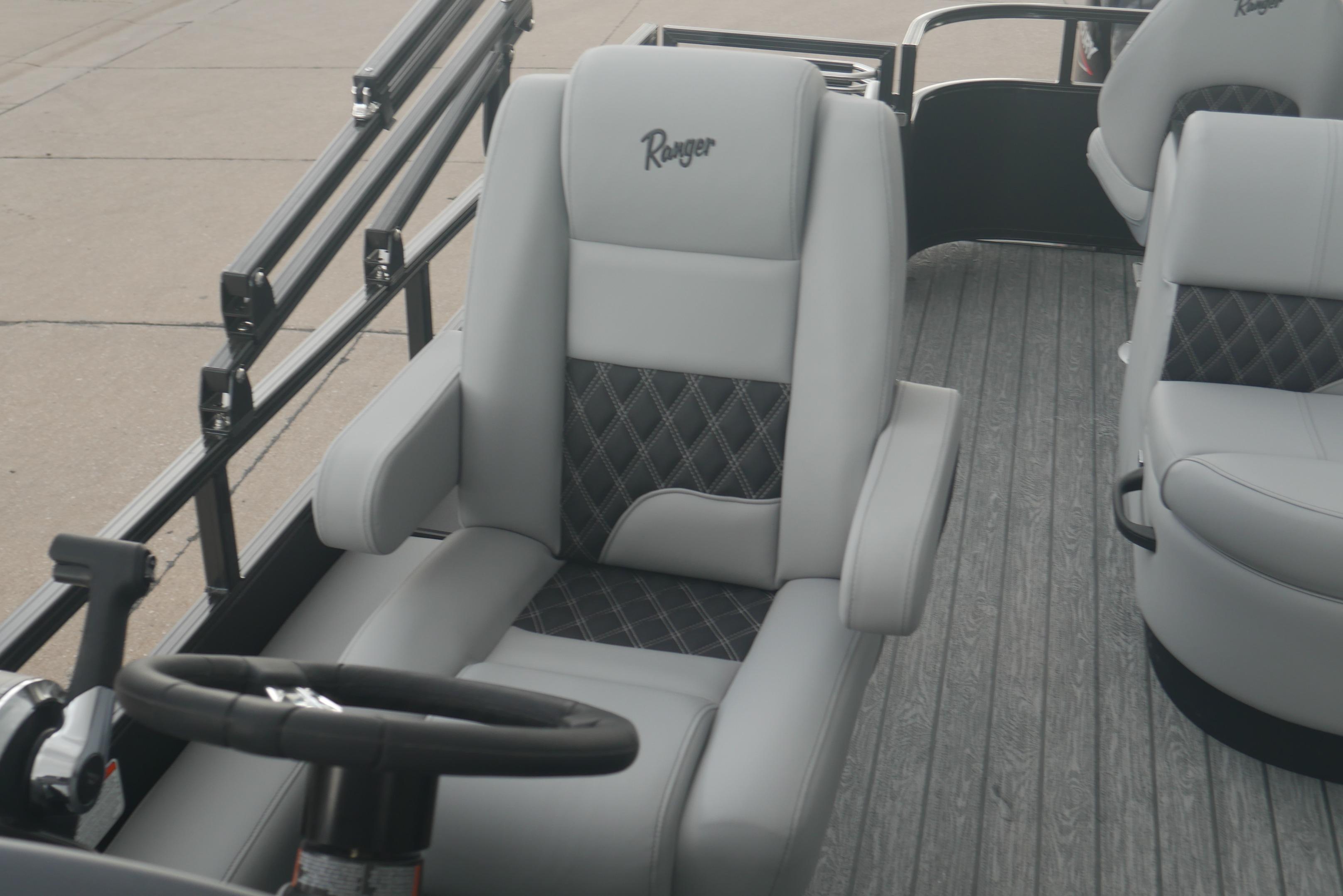2026 Ranger 220FC boat interior with luxurious seating and steering wheel.