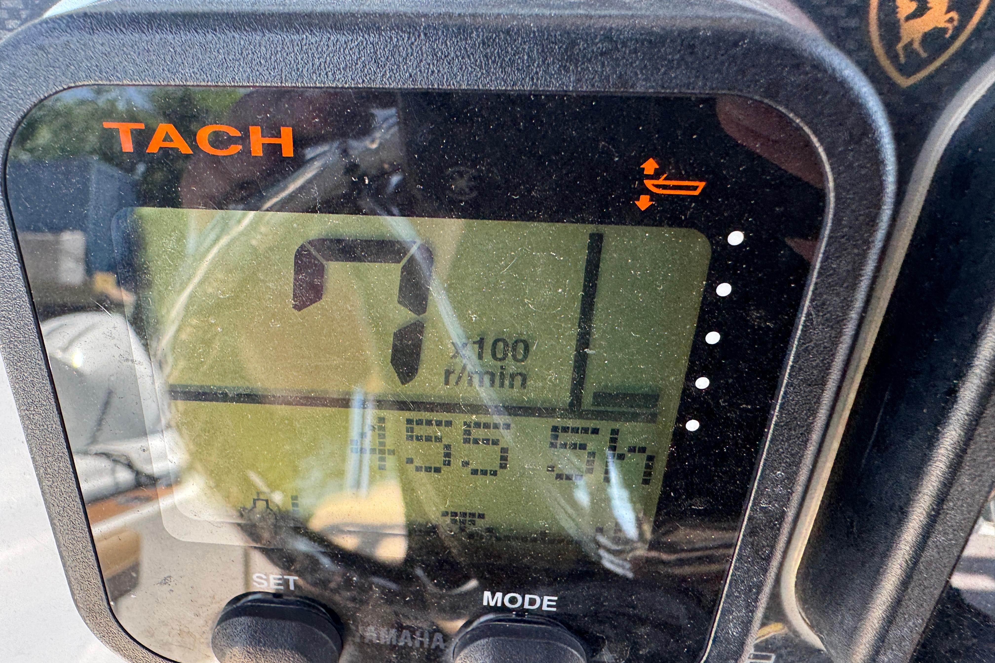 Tachometer display on a 2014 Century 2301 Center Console boat showing RPM and engine hours.