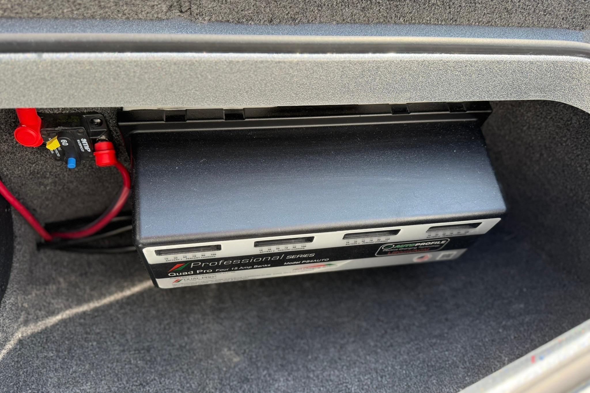 Battery compartment of 2026 Ranger 1880MS with professional series charger installed.