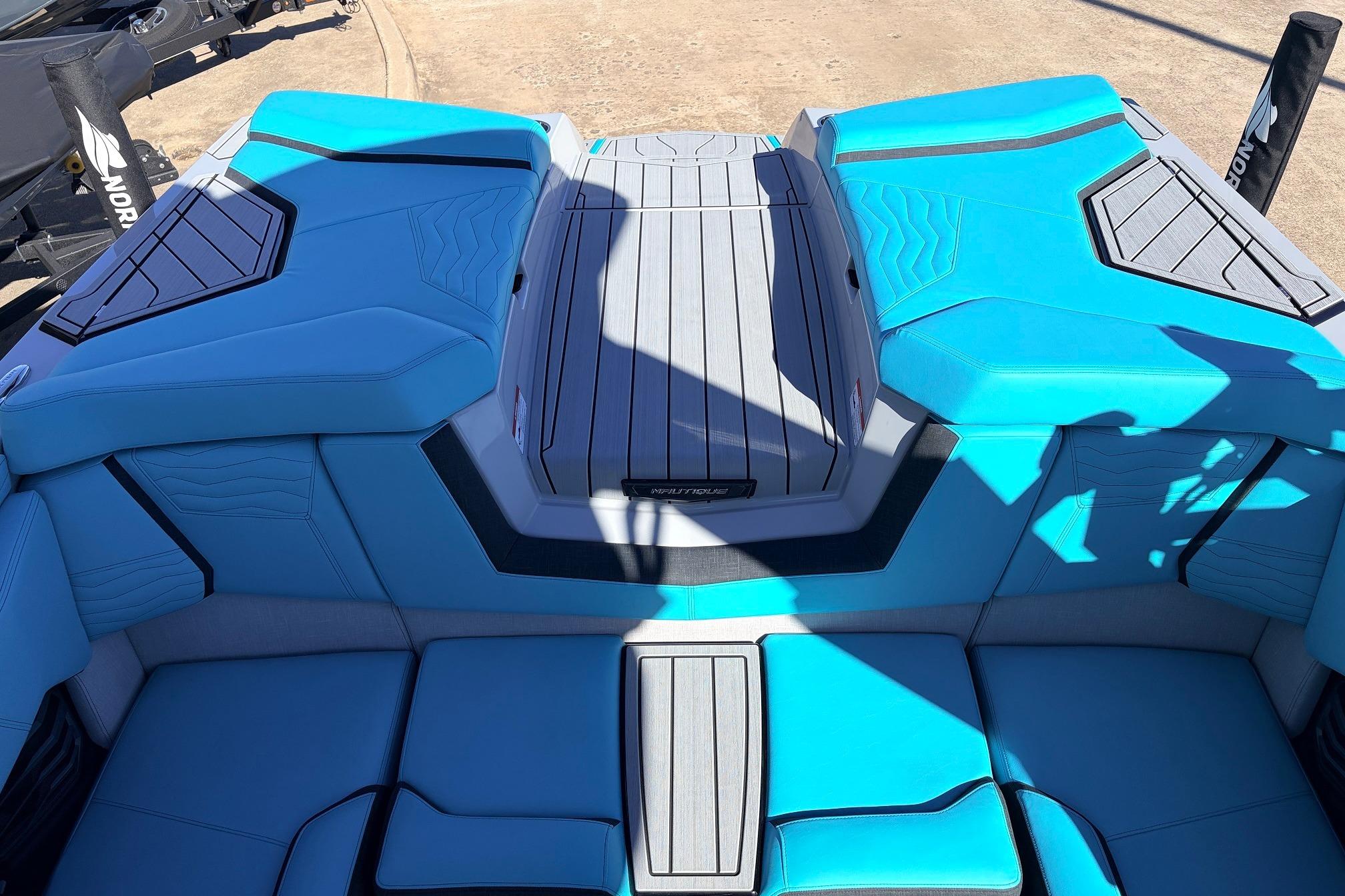 2026 Nautique Super Air Nautique G23 boat interior with blue and gray seating.