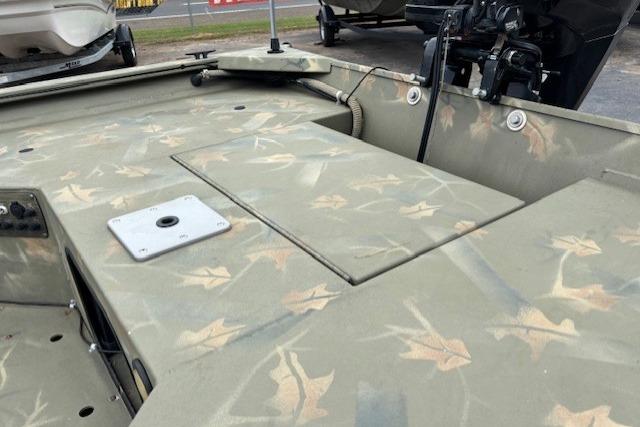 2017 Tracker Grizzly 1654 MVX Sportsman boat with camouflage interior design.