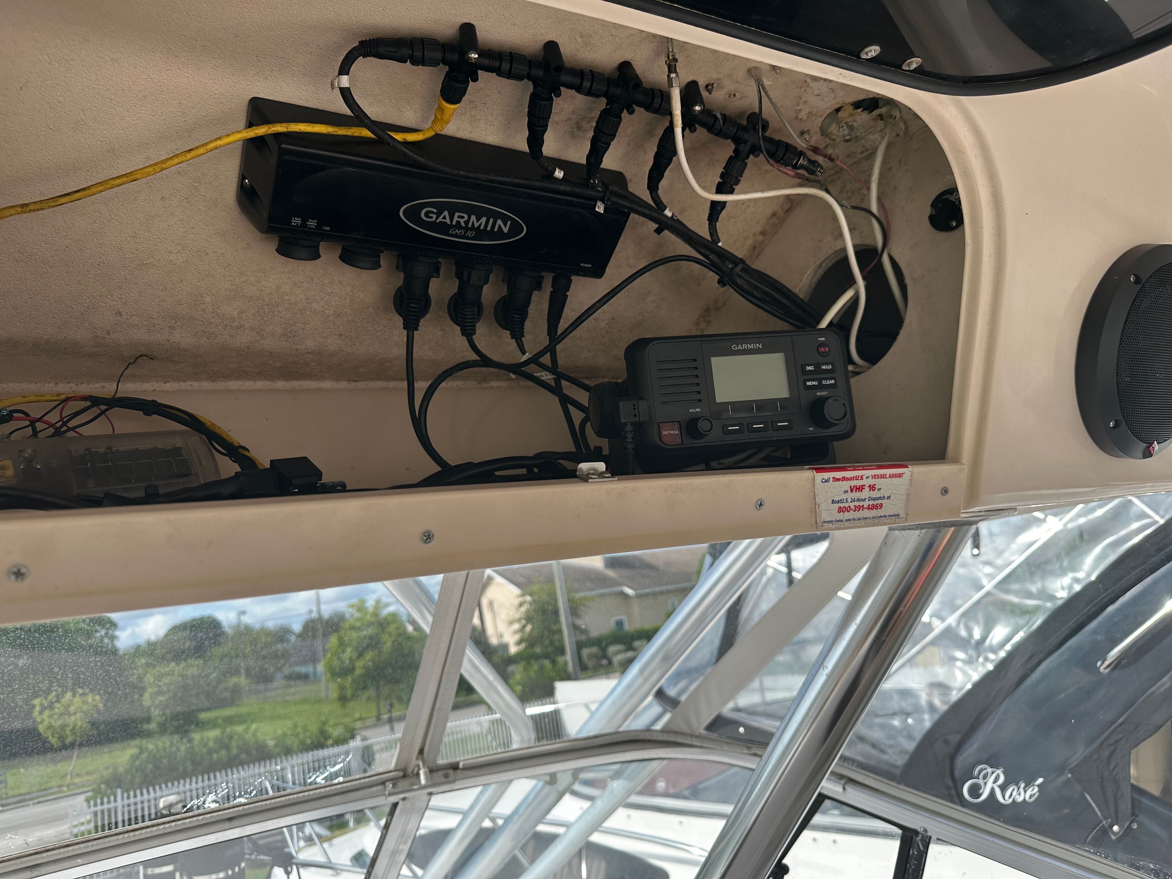 Electronic equipment and wiring in a boat cabin area.