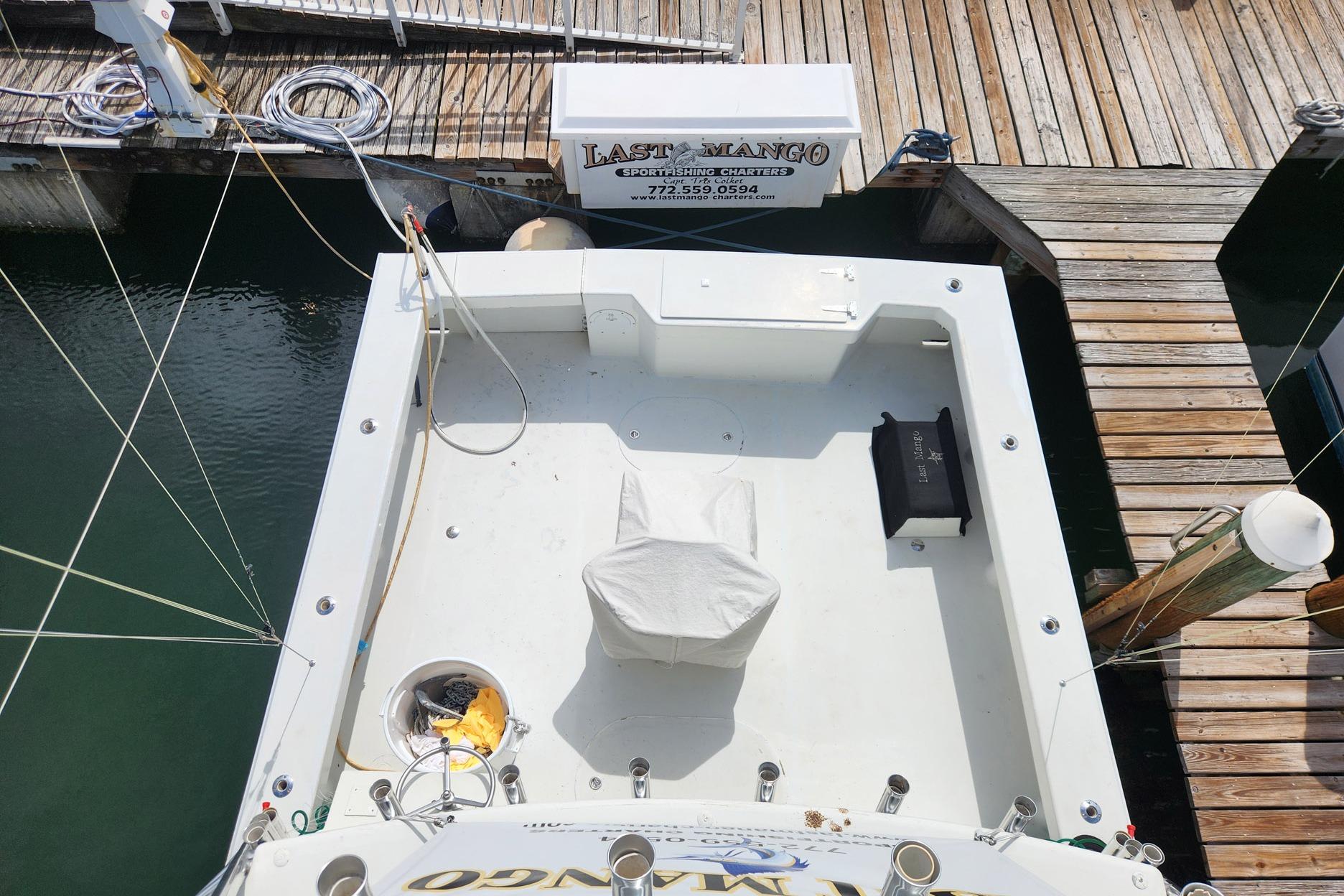 Aerial view of 1987 Young Brothers Custom Sport Fish boat docked at marina.