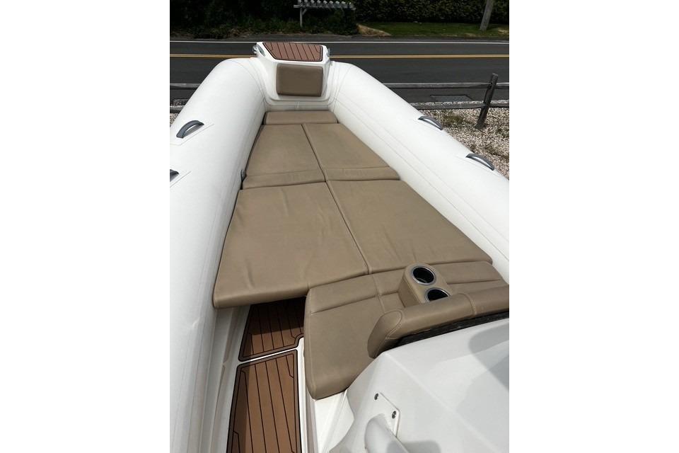 2022 Brig Eagle 8 boat interior with tan seating and cup holders.