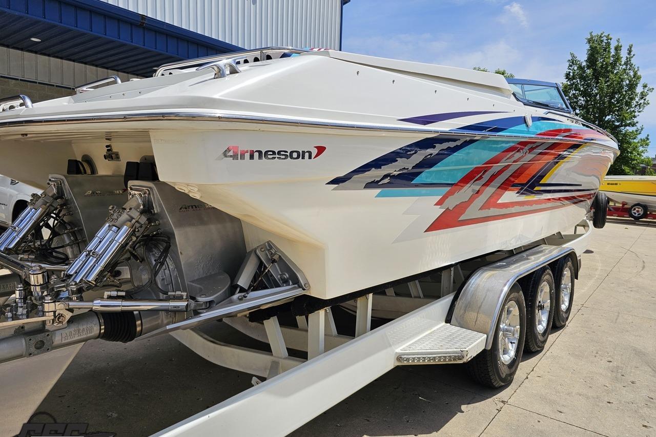 2002 Formula 382 FASTech boat with vibrant graphics on a trailer.
