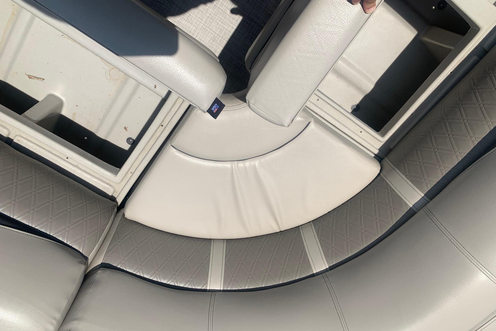 2023 Silver Wave 2410 SW3 CLS boat interior with gray cushioned seating and storage compartments.